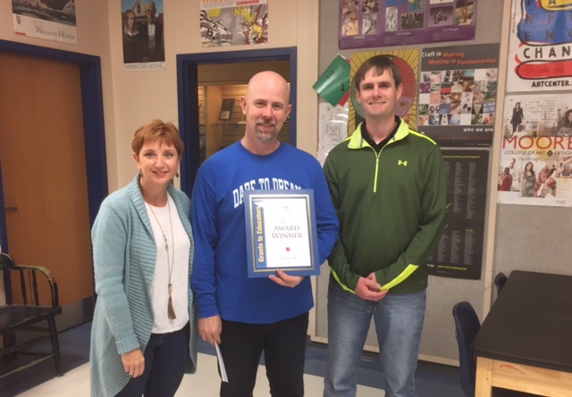 SSISD Education Foundation Board members Gena Prickette, left, and John Campbell, right, with SSHS Art Teacher Dr. Phillip Dick.