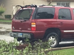 Vehicle damaged by strong thunderstorm. Photo by Chad Young.