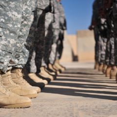 Abbott Lets National Guard Carry Arms on Base