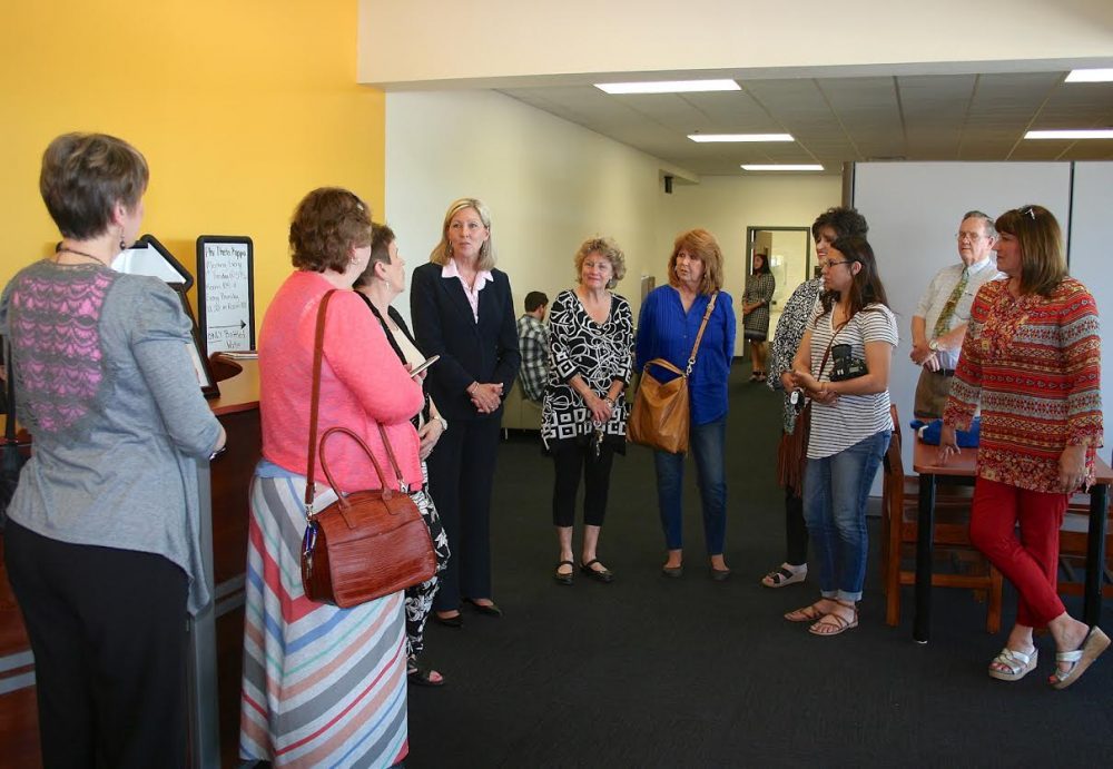Dr. Pam Anglin, PJC President, tells some of the open house visitors about features they will see in the new PJC-Sulphur Springs campus building.