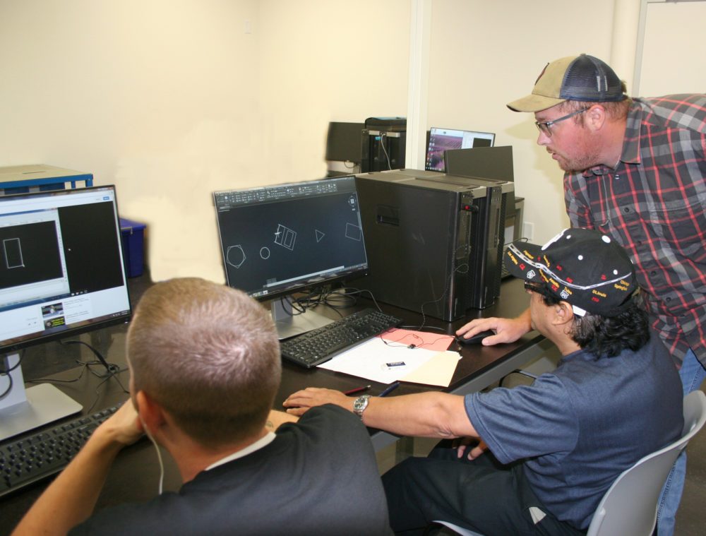 COMPUTER AIDED DRAFTING Students Stephen Hudson, left, and Francisco Vazquez receive help from Instructor Brandon Eulberg in the basic computer aided drafting class at the PJC-Sulphur Springs Center campus. The new workforce training program was launched in the fall semester class lineup. To inquire about this program and other workforce training opportunities, call 903-885-1232.