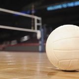 Volleyball on Wood Floor with net