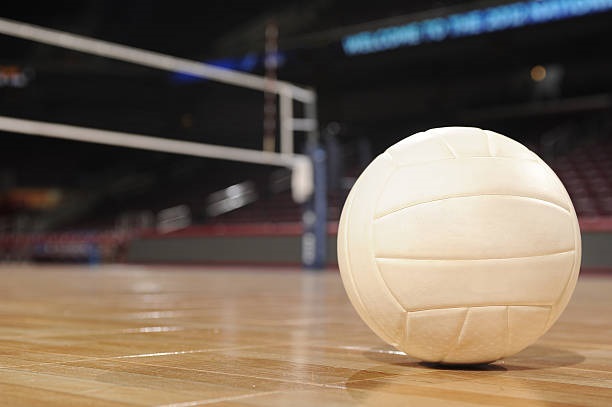 Volleyball on Wood Floor with net