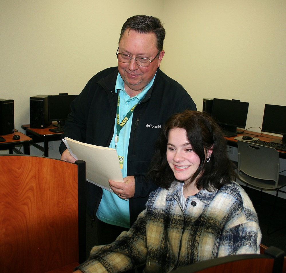 Paris Junior College Sulphur Springs class PJC Center Director Rob Stanley assists