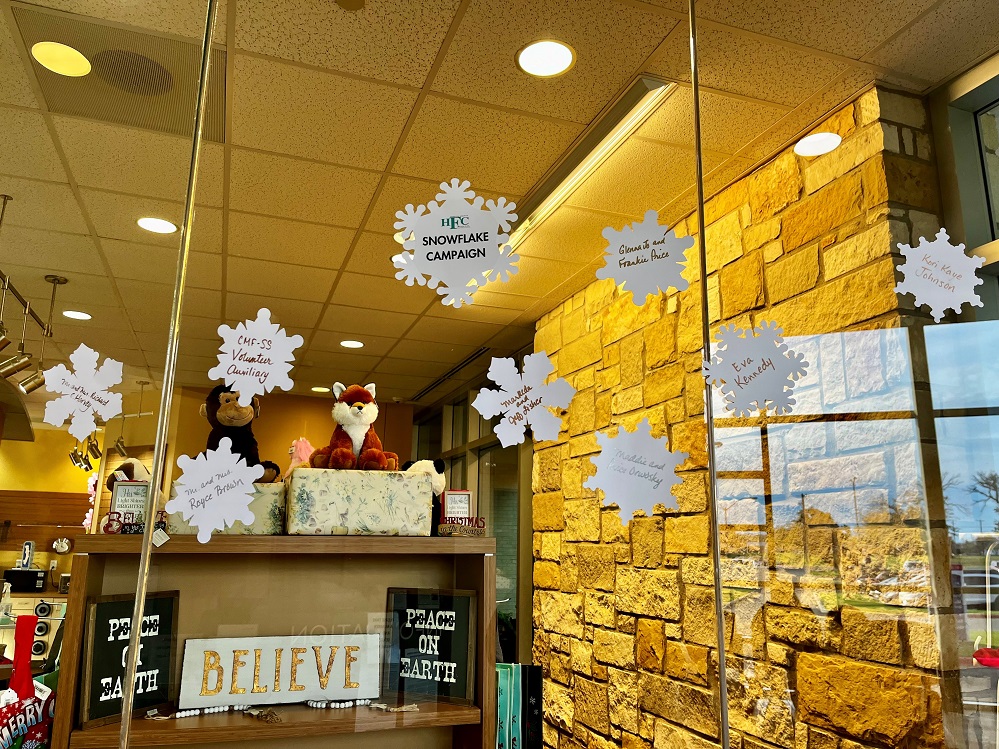 Photo 2: The first of the snowflakes have alighted on the windows of the CMF-SS lobby. To honor or memorialize a friend or loved one, go to Snowflake2023.givesmart.com.