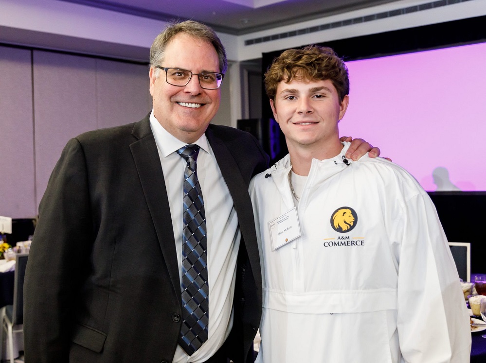 A&M-Commerce President Mark Rudin and student Major McBride