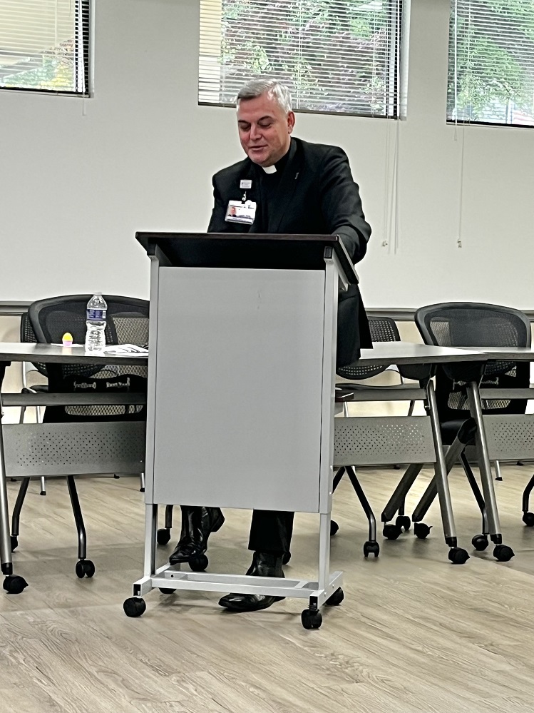 Father Justin Wylie speaks at the April meeting of the Hopkins County Health Care Foundation’s Breast Cancer Support Group. The next meeting will be May 12 at 5:30 p.m., 113 Airport Rd.