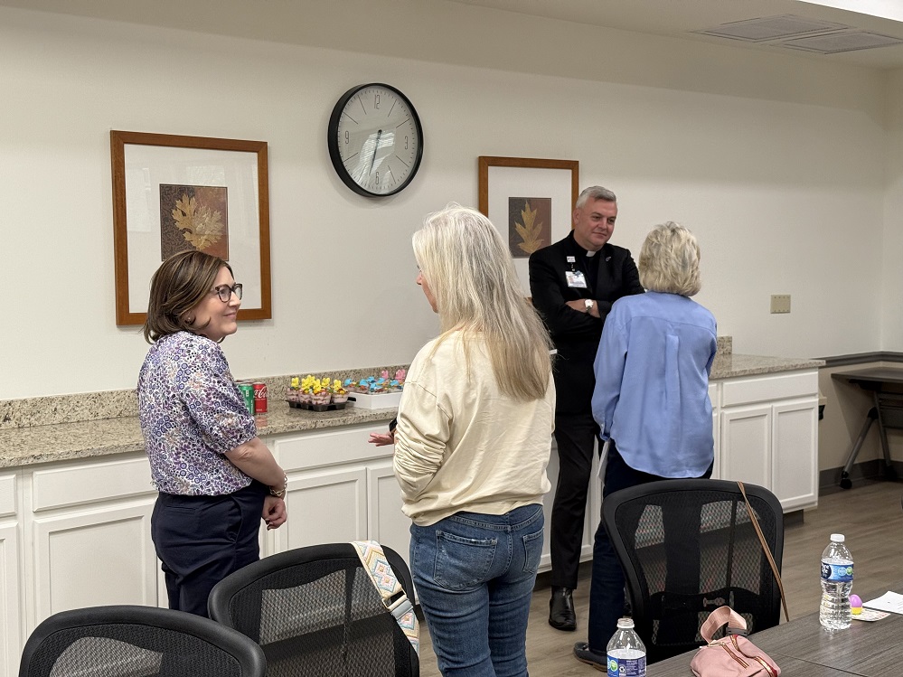 Members of the Hopkins County Breast Cancer Support Group catch up after hearing a presentation by Father Justin Wylie, Director of Pastoral Care for CHRISTUS Mother Frances Hospital – Sulphur Springs.