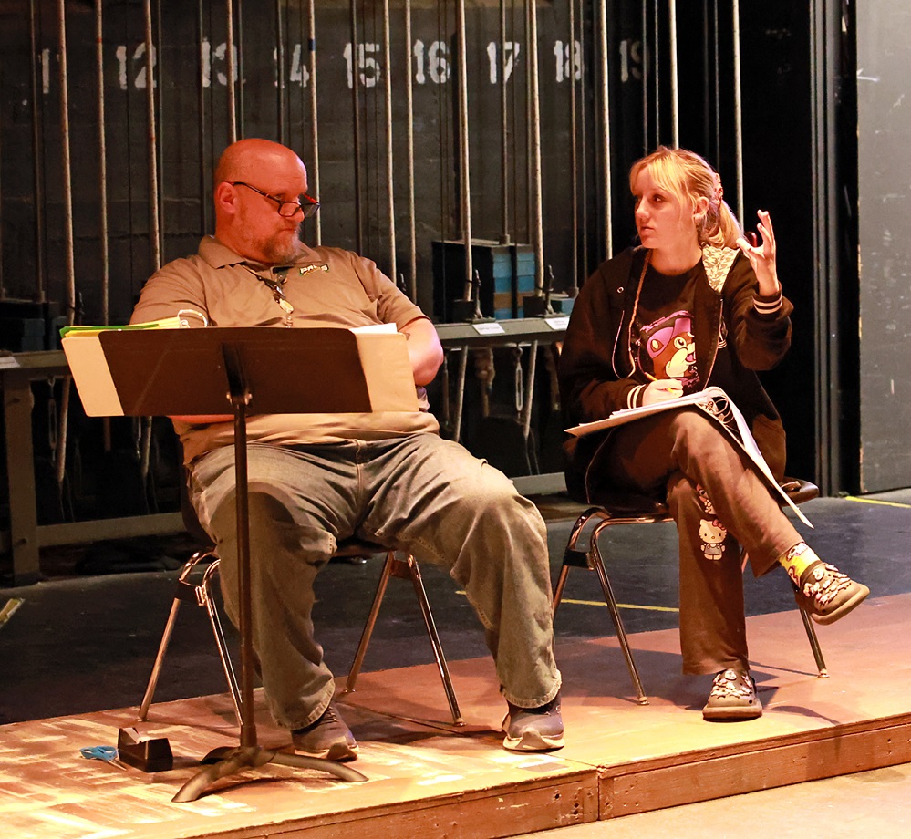 PlayFest Director Will Walker discusses directing and blocking with drama student Addison Brown prior to a rehearsal.
