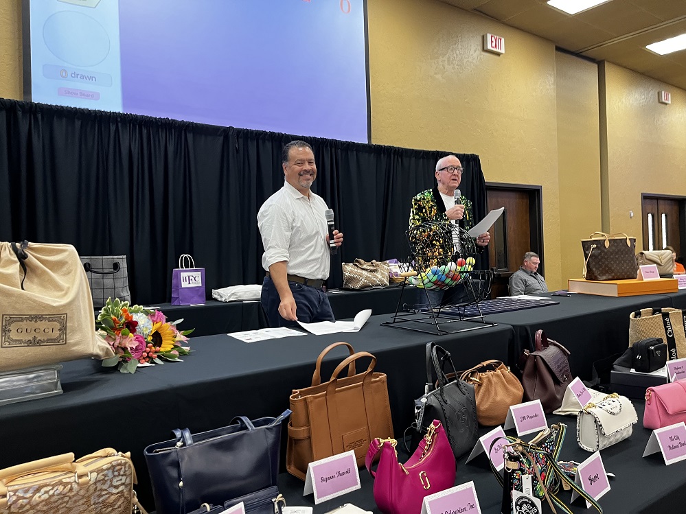 The Hopkins County Health Care Foundation’s Designer Handbag Bingo is sold out for August 7, but there is still a way to win. Visit handbagbingo25.GiveSmart.com to purchase Mystery Handbag Raffle tickets. 300 tickets will be available at $30 each for the chance to win the luxury handbag valued in the mid 4-digit range. You do not need to be present to win, but the prize must be picked up locally. In this 2024 photo, Dr. Martin Fielder (left) smiles for the camera as Dr. David Black (right) gives bingo instructions to the crowd.