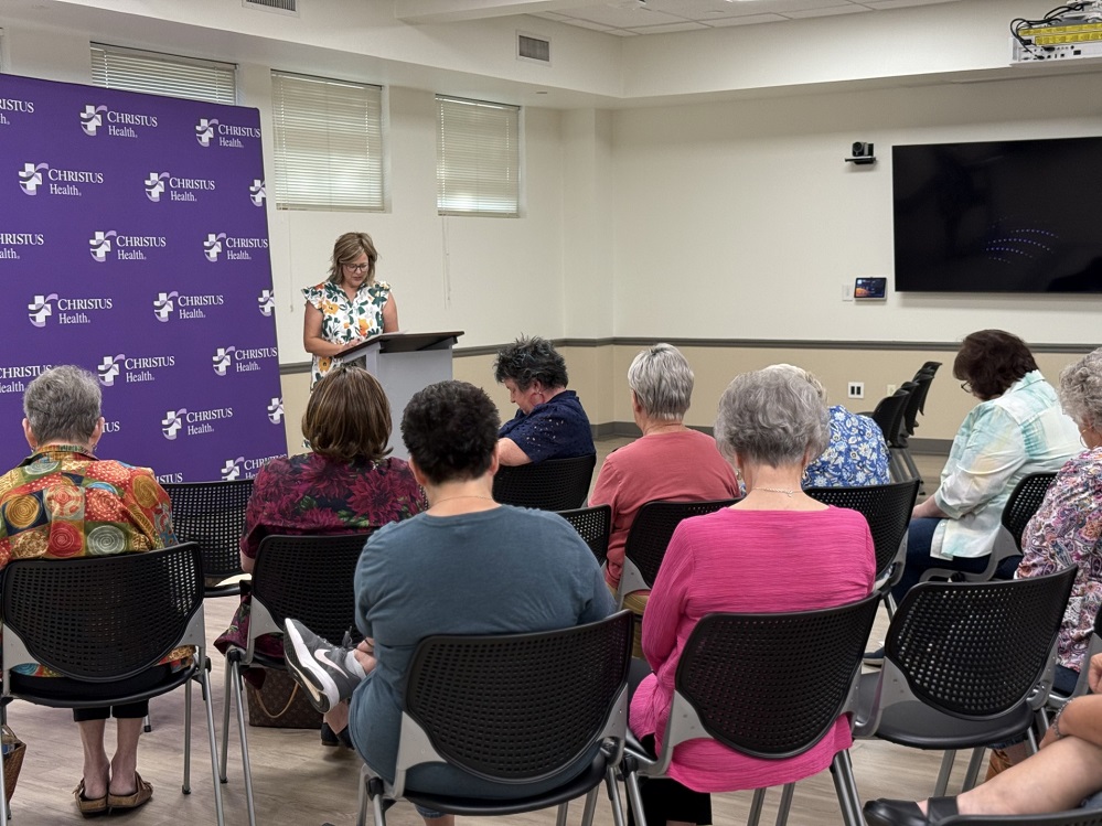 Kristi Brewer, chair of the support group, led the women of the breast cancer support group in prayer before adjourning to enjoy refreshments provided by Carolyn McKinney