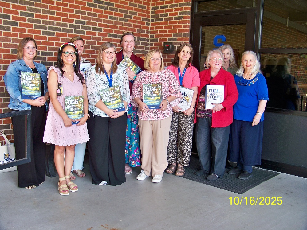 far right are the 3 ladies who presented the books. In the red jacket is Marynell Bryant, to her left in the blue top is myself and behind us, in green, is Christy Sanders who will be presenting the book to the Yantis Elementary School. There were only 7 of the school staff to receive the books, as several were out due to illness.