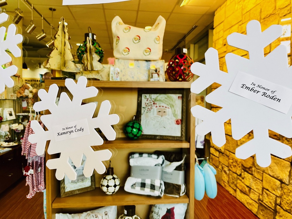 Two snowflakes glisten on the glass wall of the CHRISTUS Mother Frances Hospital – Sulphur Springs lobby as a painting of Santa and other goodies are visible in the background. The Johnnie Masters Gift Shop, that is operated by a dedicated group of volunteers who make up the hospital auxiliary, features fun items for the holidays. To recognize your friends and loved ones with a snowflake, visit Snowflake2025.GiveSmart.com.